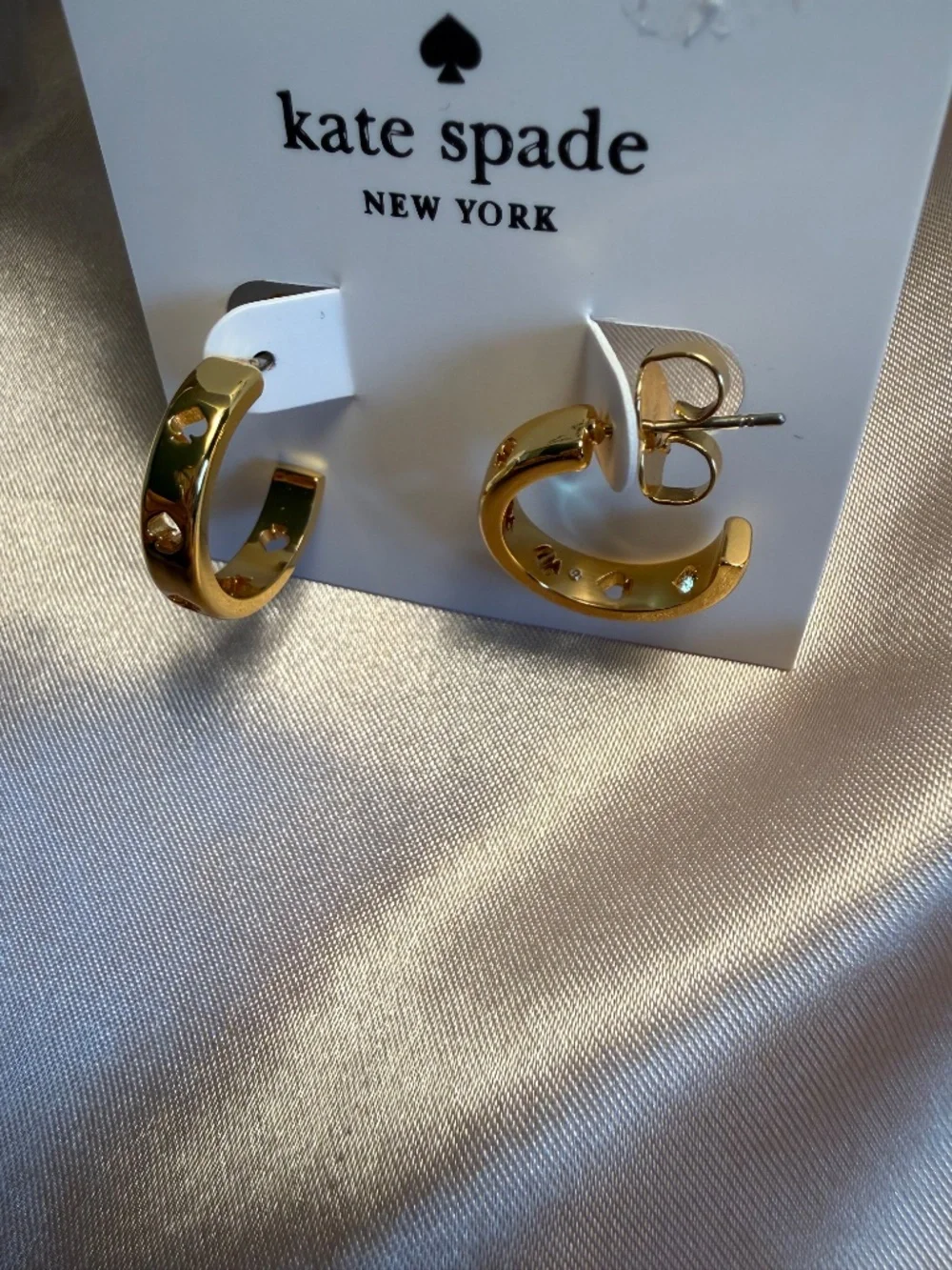 Kate Spade cut out hoop earrings in gold
